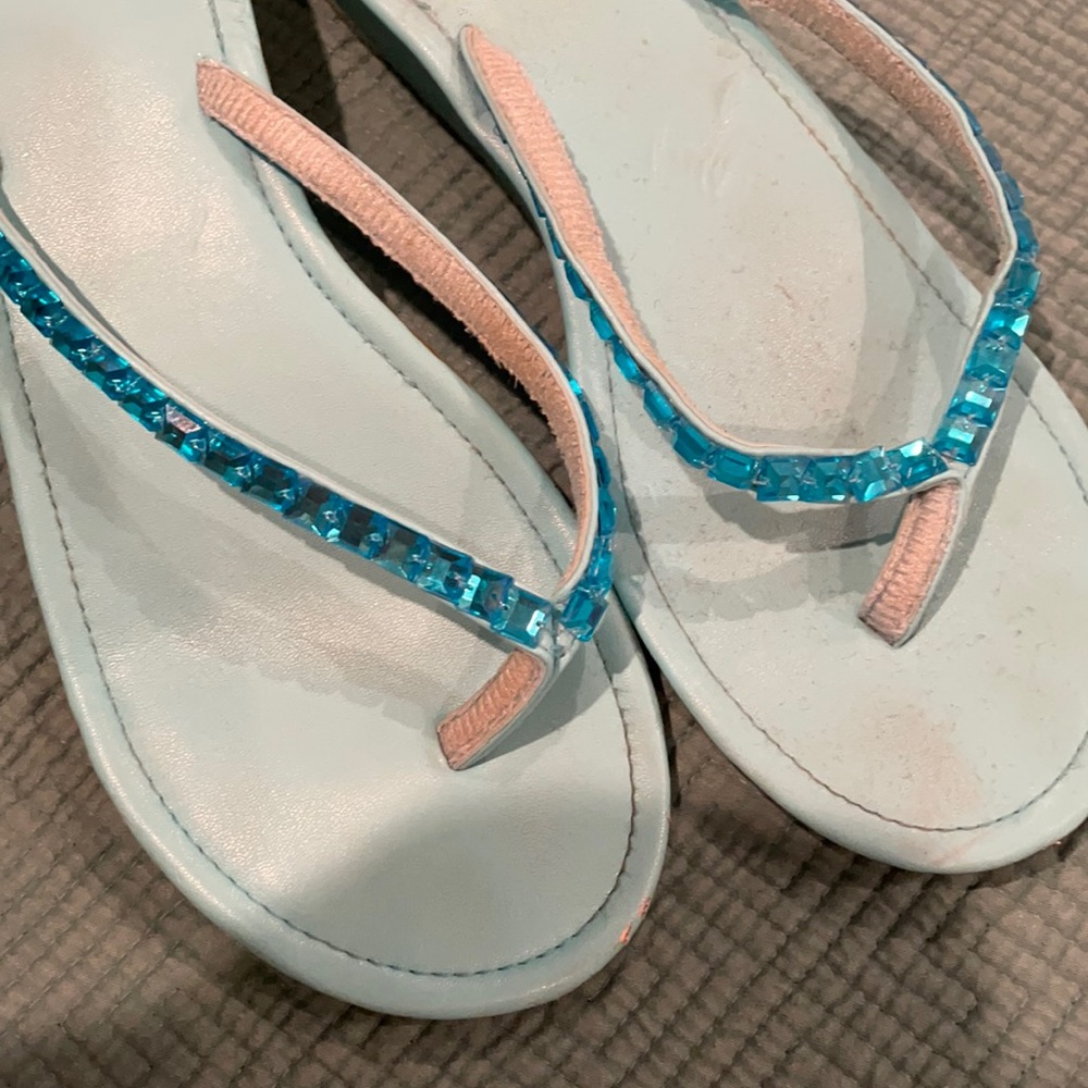 Turquoise sparkly flip flops